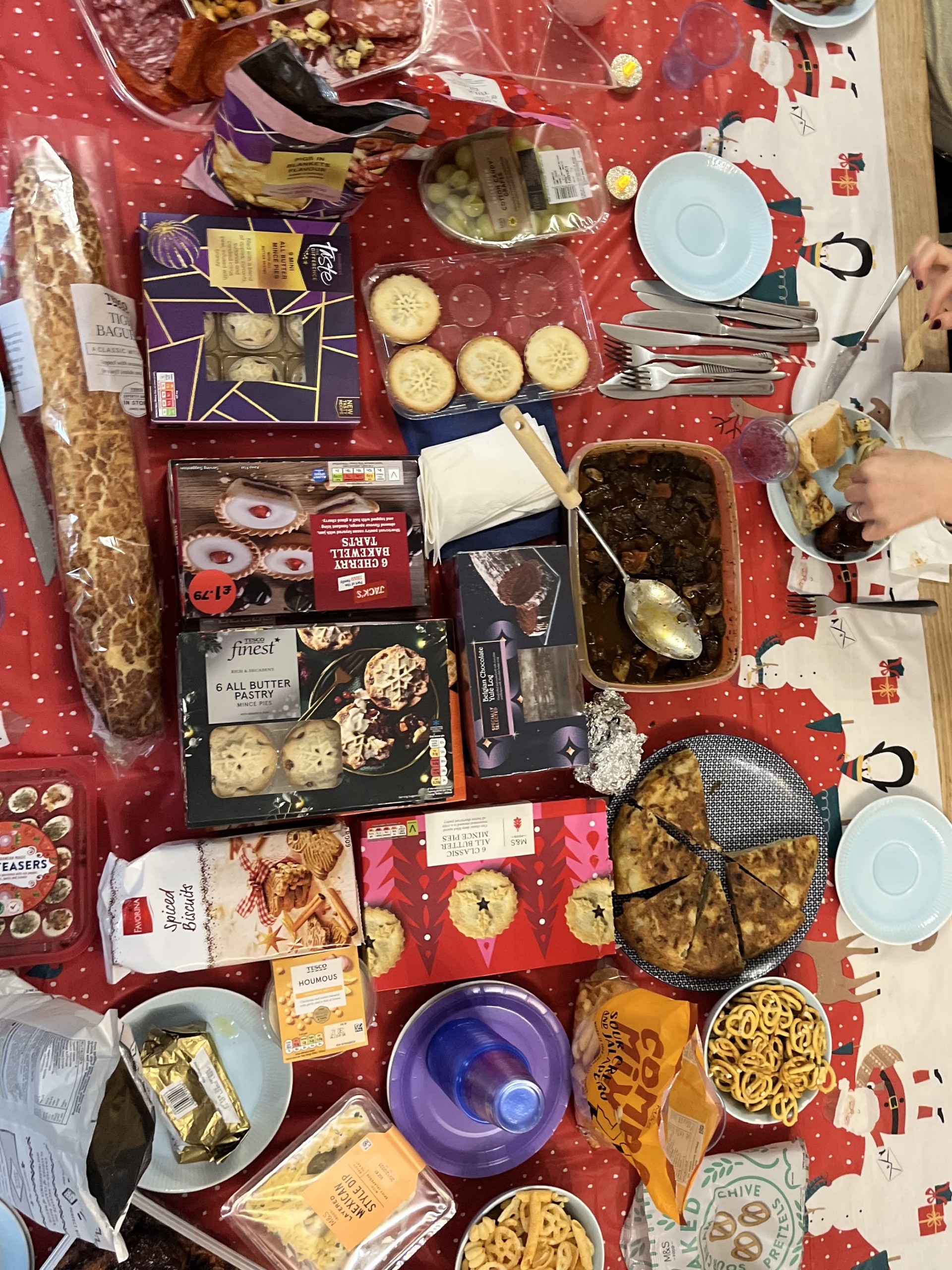 Picture shows a table of Christmas goodies to eat